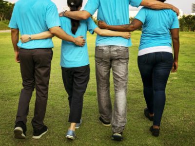 back-view-group-walking-arm-in-arm-pexels-photo-1282267